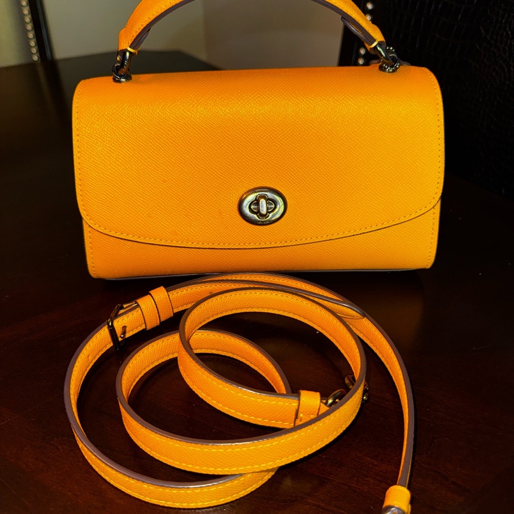 Elegant Mustard Yellow Women's Handbag by Coach